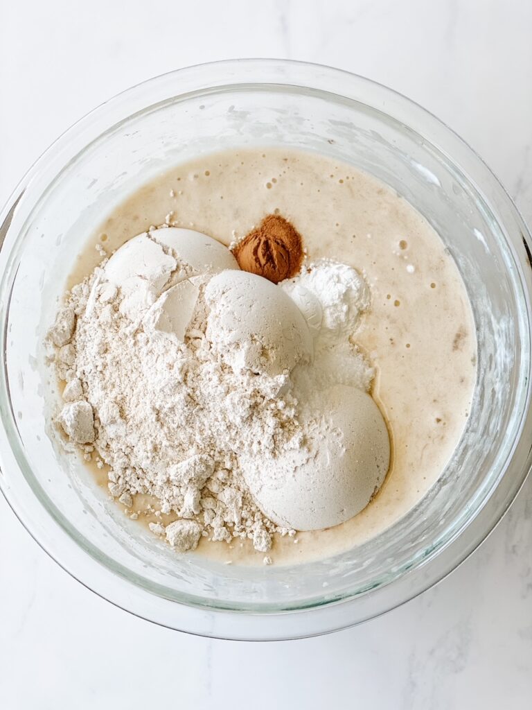 dry ingredients mixing into wet ingredients for muffins