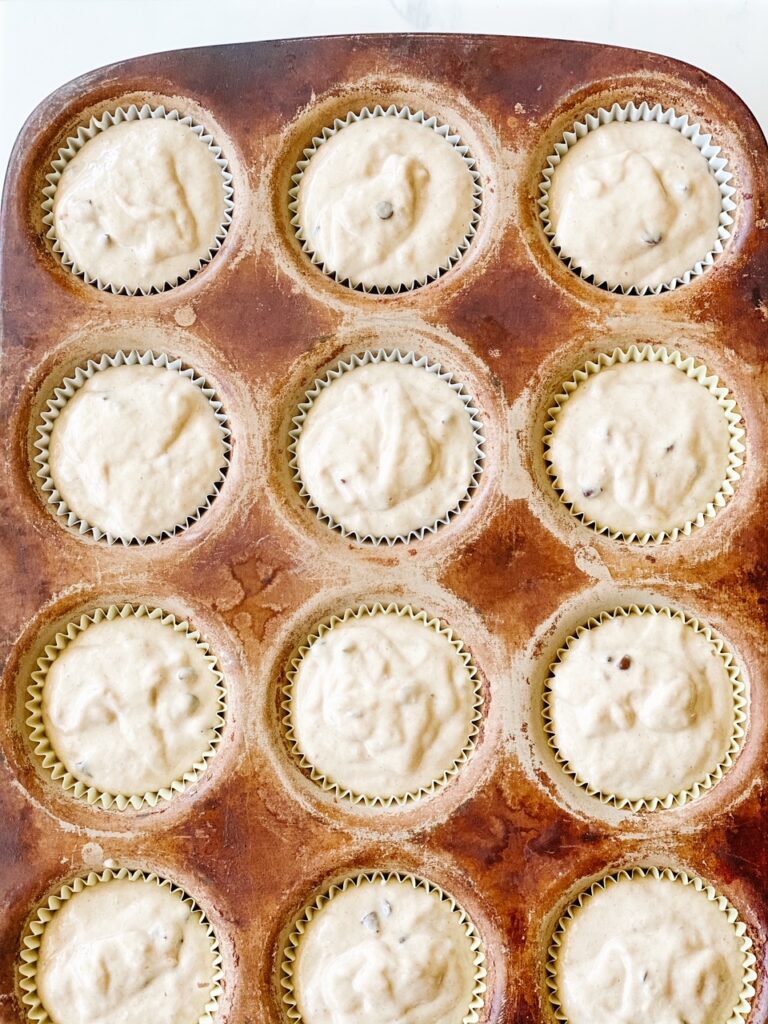 muffin batter in a muffin tin