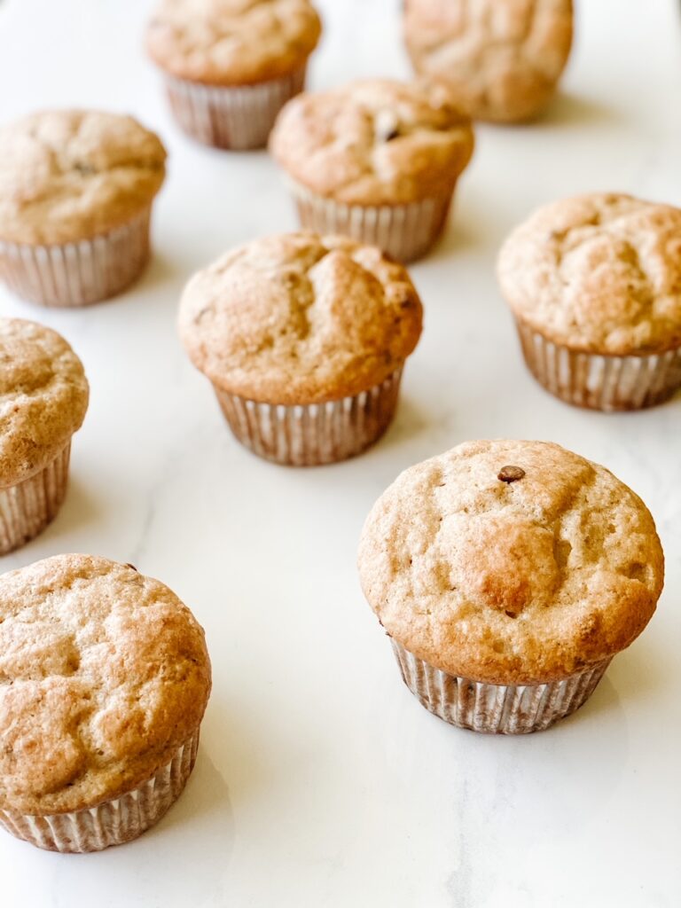 freshly baked banana bread muffins on a white backdrop