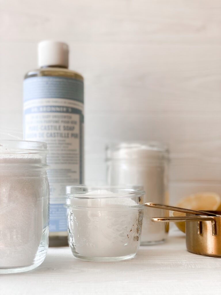 white backdrop with ingredients for diy laundry soap