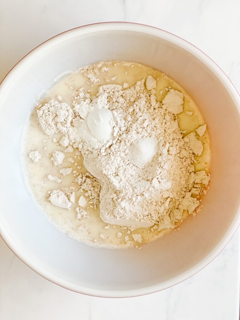 mixing dry ingredients with the wet ingredients for oat flour quick bread