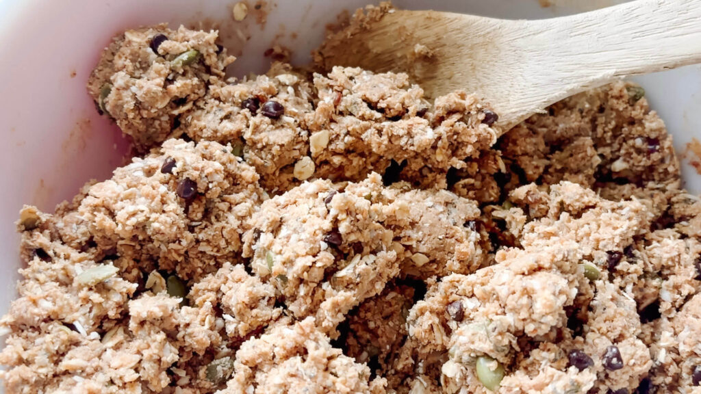 high protein breakfast cookie dough in a large bowl with wooden spoon